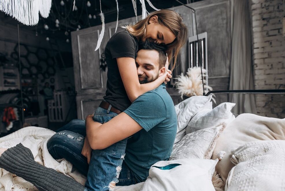 a woman embracing a power-enhancing man